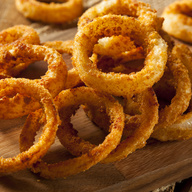 Crispy onion slices deep-fried until golden-brown